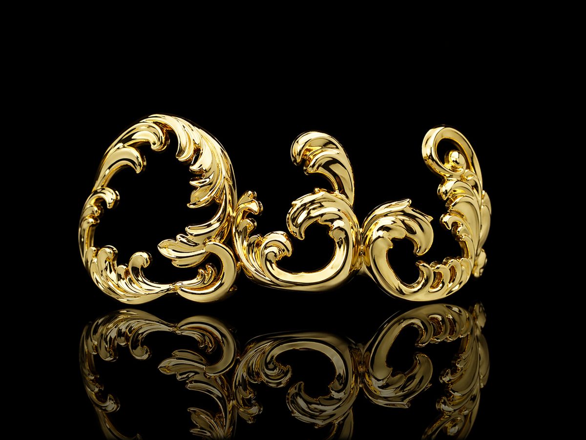 Ornamental gold dental jewel with baroque scrollwork — Atelier Fabbro